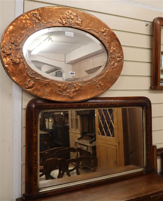 A copper wall mirror in the Arts and Crafts style W.76cm